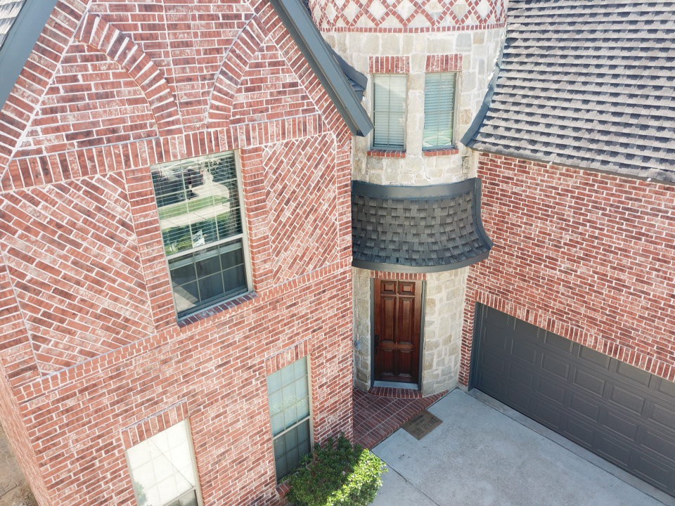 Aerial detail shot of turret roof with intricate brickwork - Premium craftsmanship